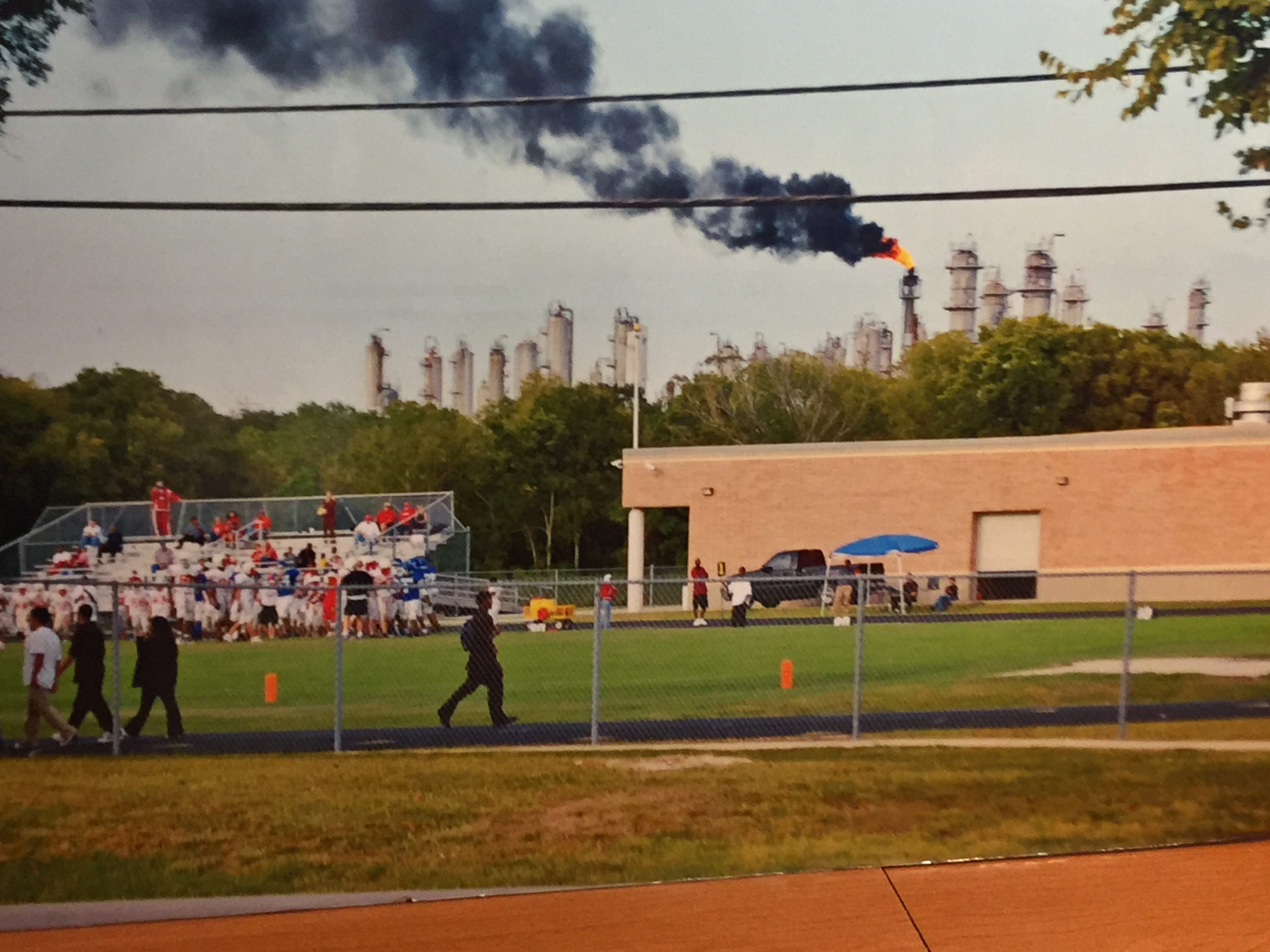 Smokestacks release air pollution right behind a park’s sportsfield